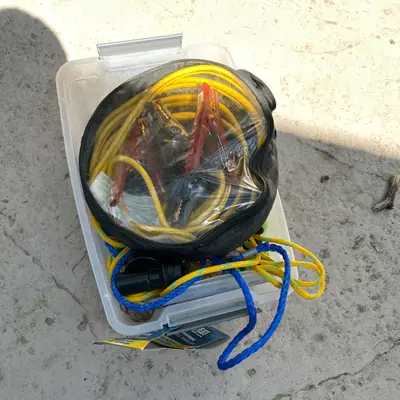 Auto recovery tub: jumper cables, tow rope, hand tools