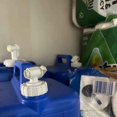 Blue water storage jugs
