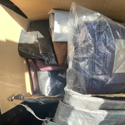 Box of tarps and tent fabric
