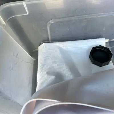 Bin with cloth and bottle cap