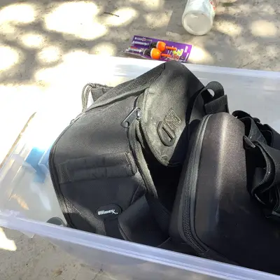 Bin of bags and body straps