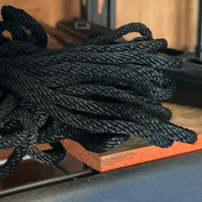 Black rope coil