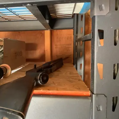 Wheeled tool under shelf