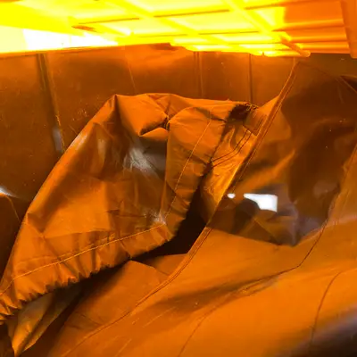 Container of brown nylon bags
