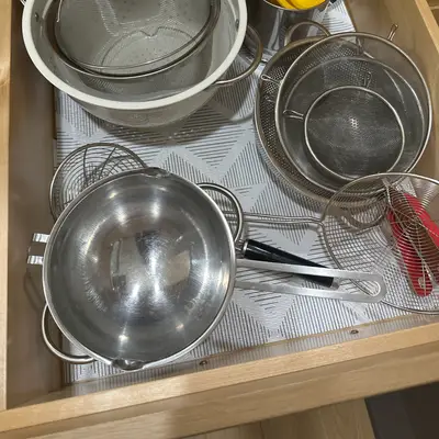 Stainless steel strainers and saucepan