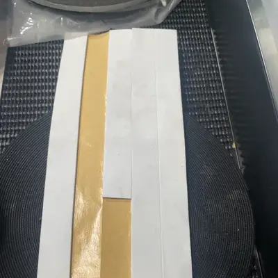White adhesive-backed strips